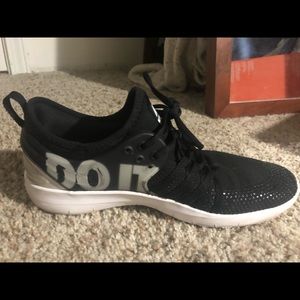 One shoe says “just” and the other says “do it”.